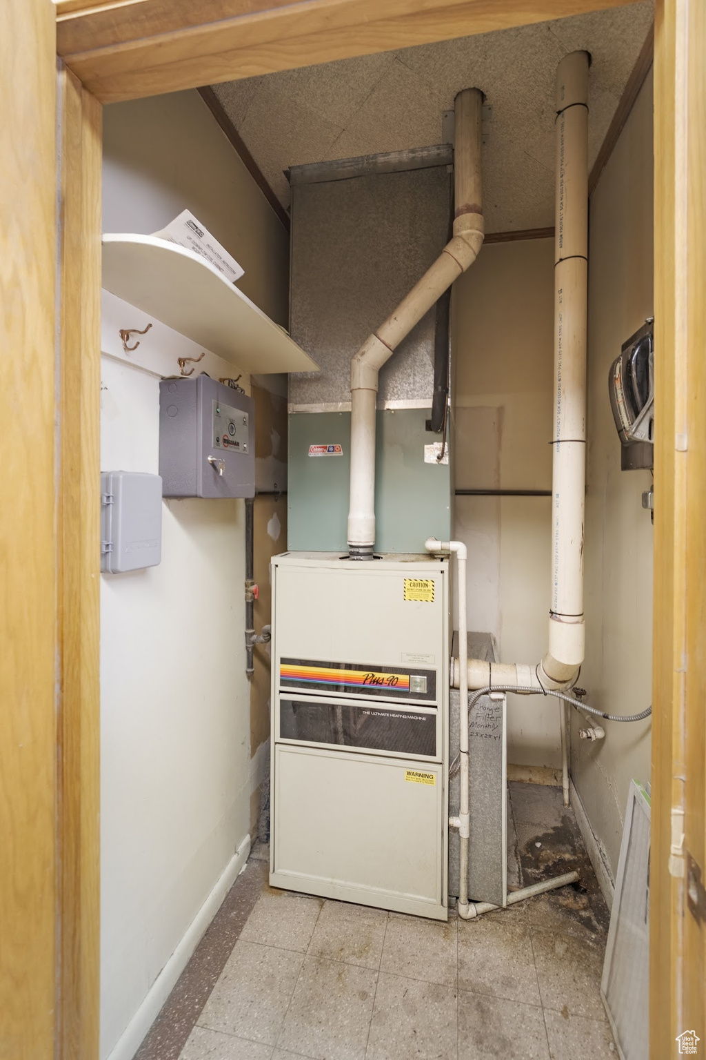 View of utility room 90% furnace
