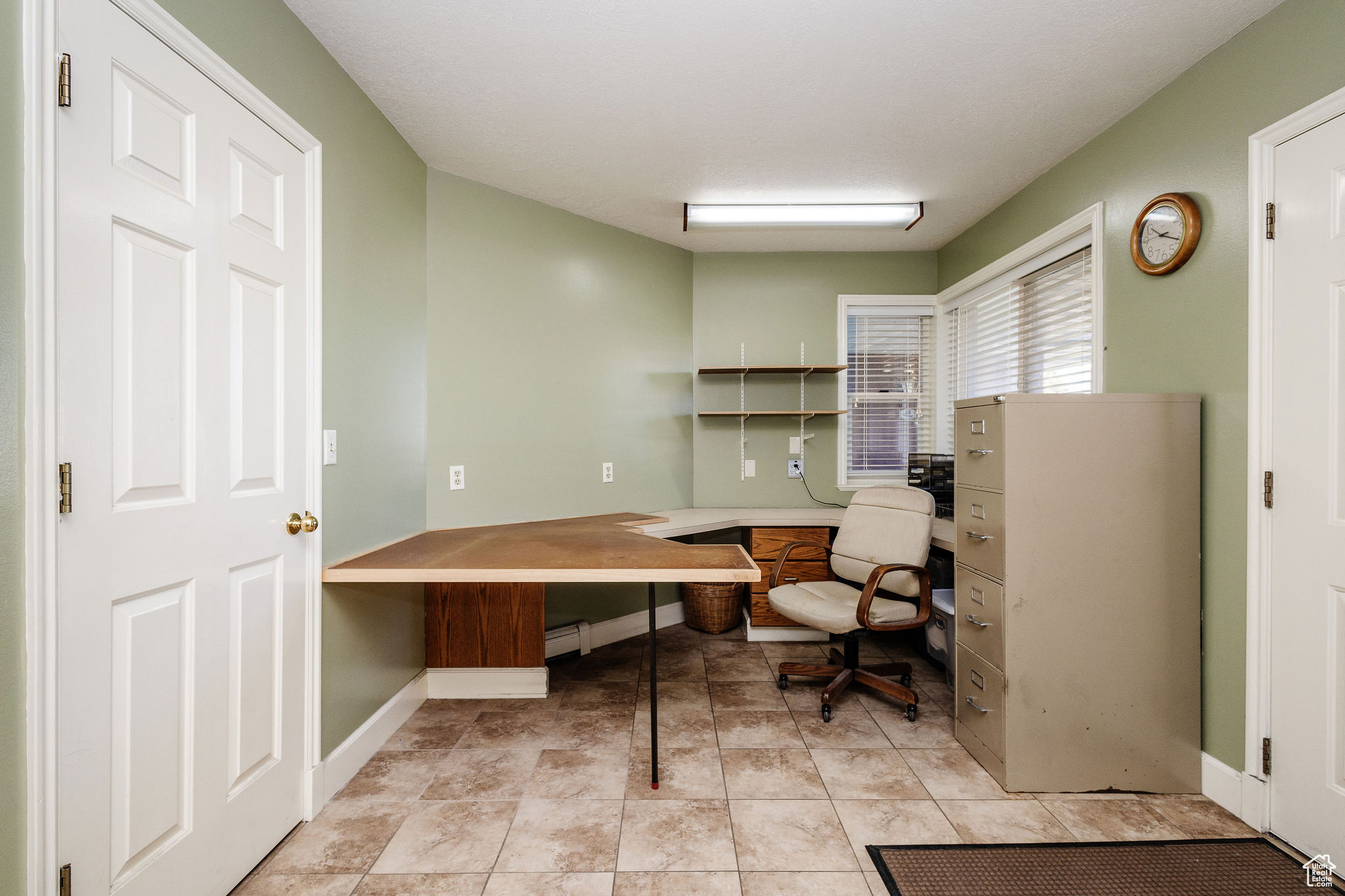 Office area with light tile floors
