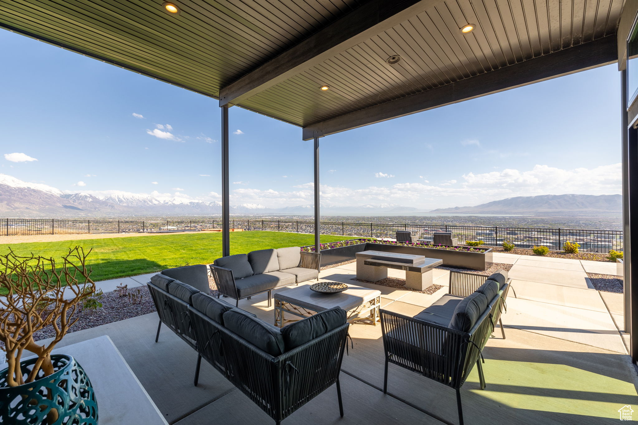View of patio / terrace featuring a mountain view and an outdoor living space with a fire pit