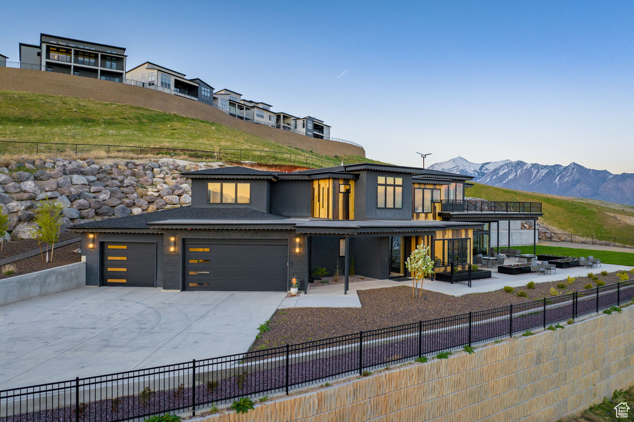 Modern home with a mountain view and a garage