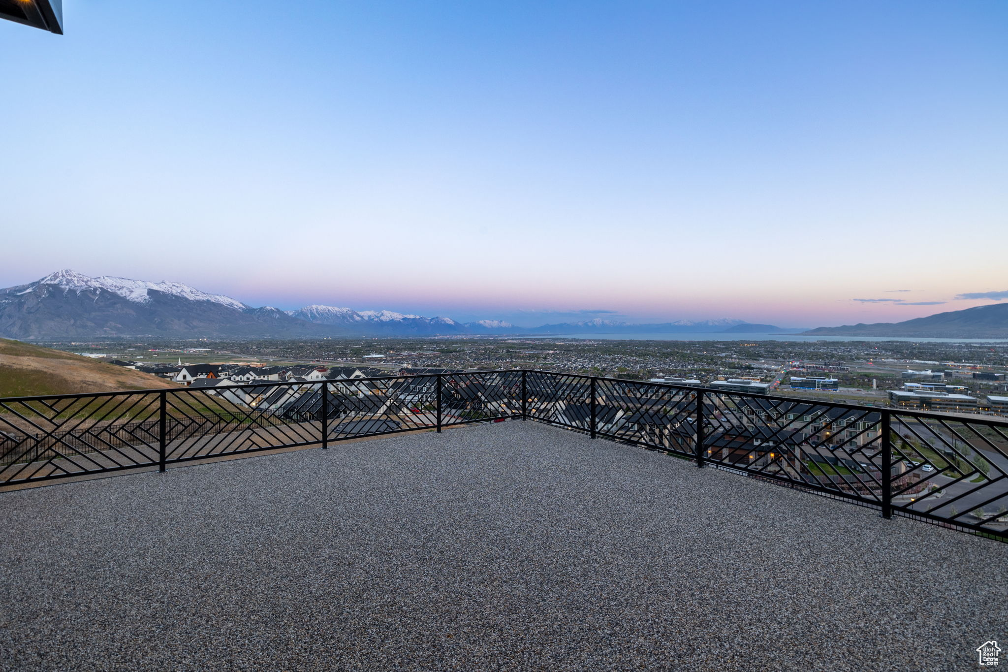 Patio terrace at dusk with a mountain view