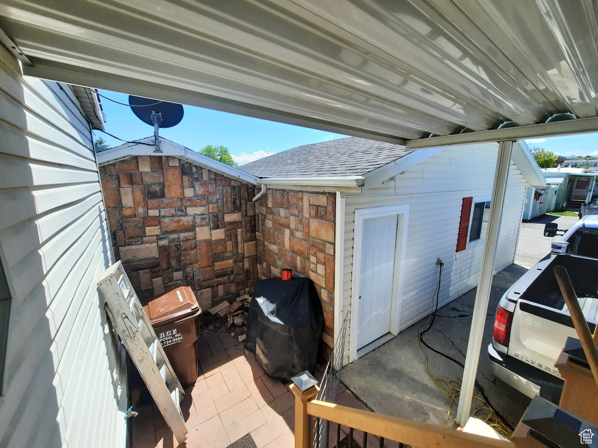 Back with covered patio & detached garage & shed