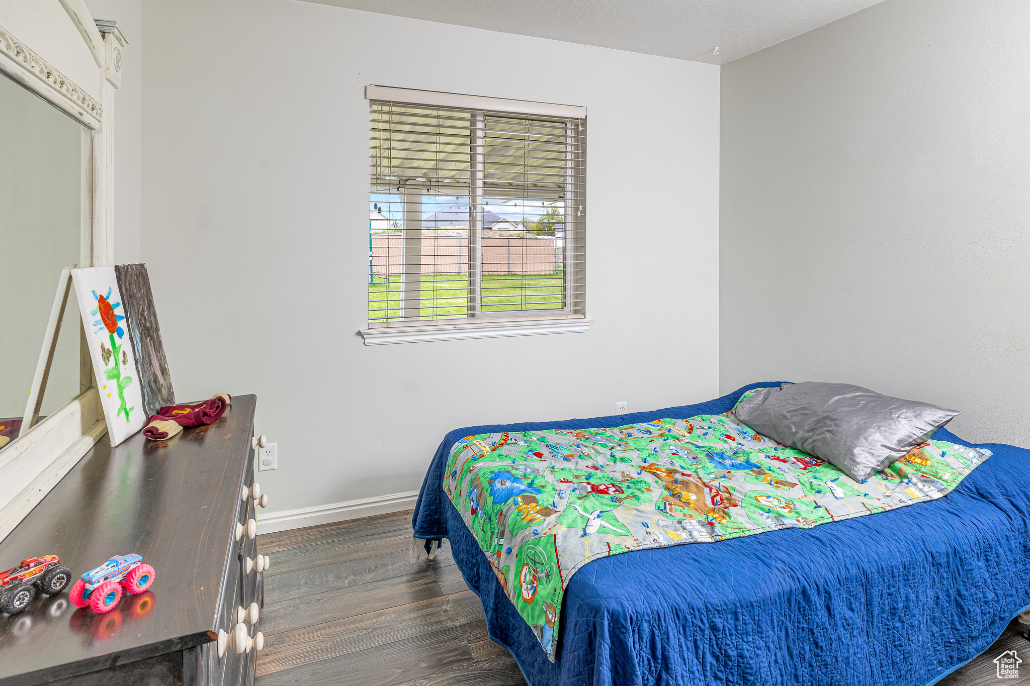 Bedroom with dark wood-type flooring