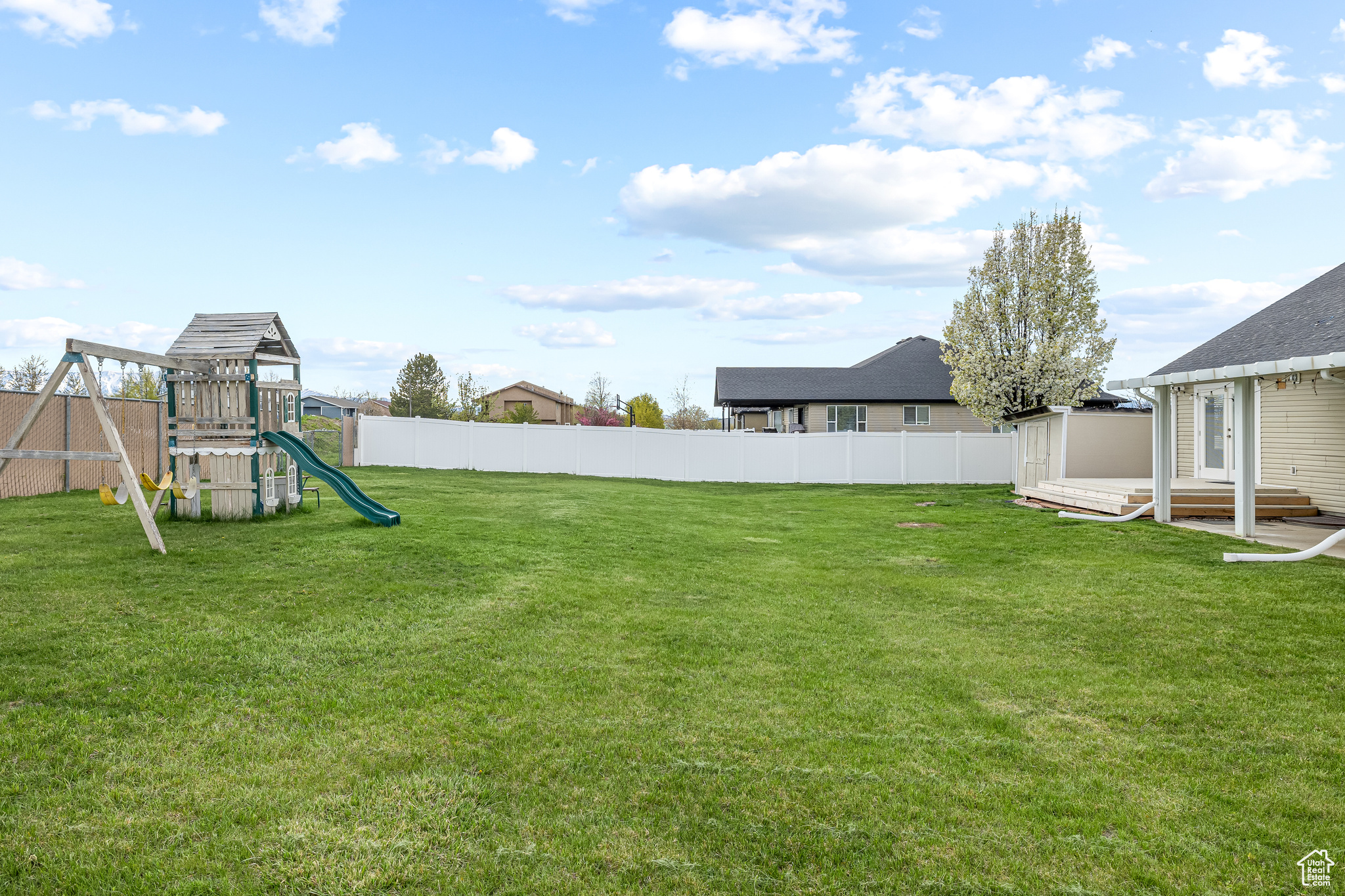 View of yard featuring a playground