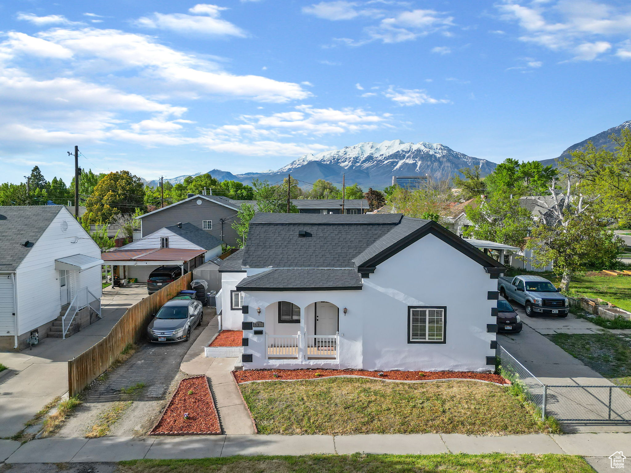 View of front of property featuring a mountain view and a carport