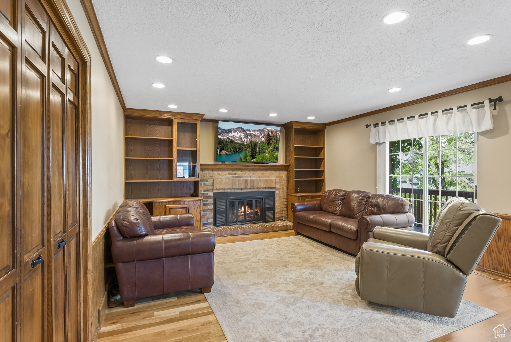 Family room with walkout to deck and warm, inviting fireplace
