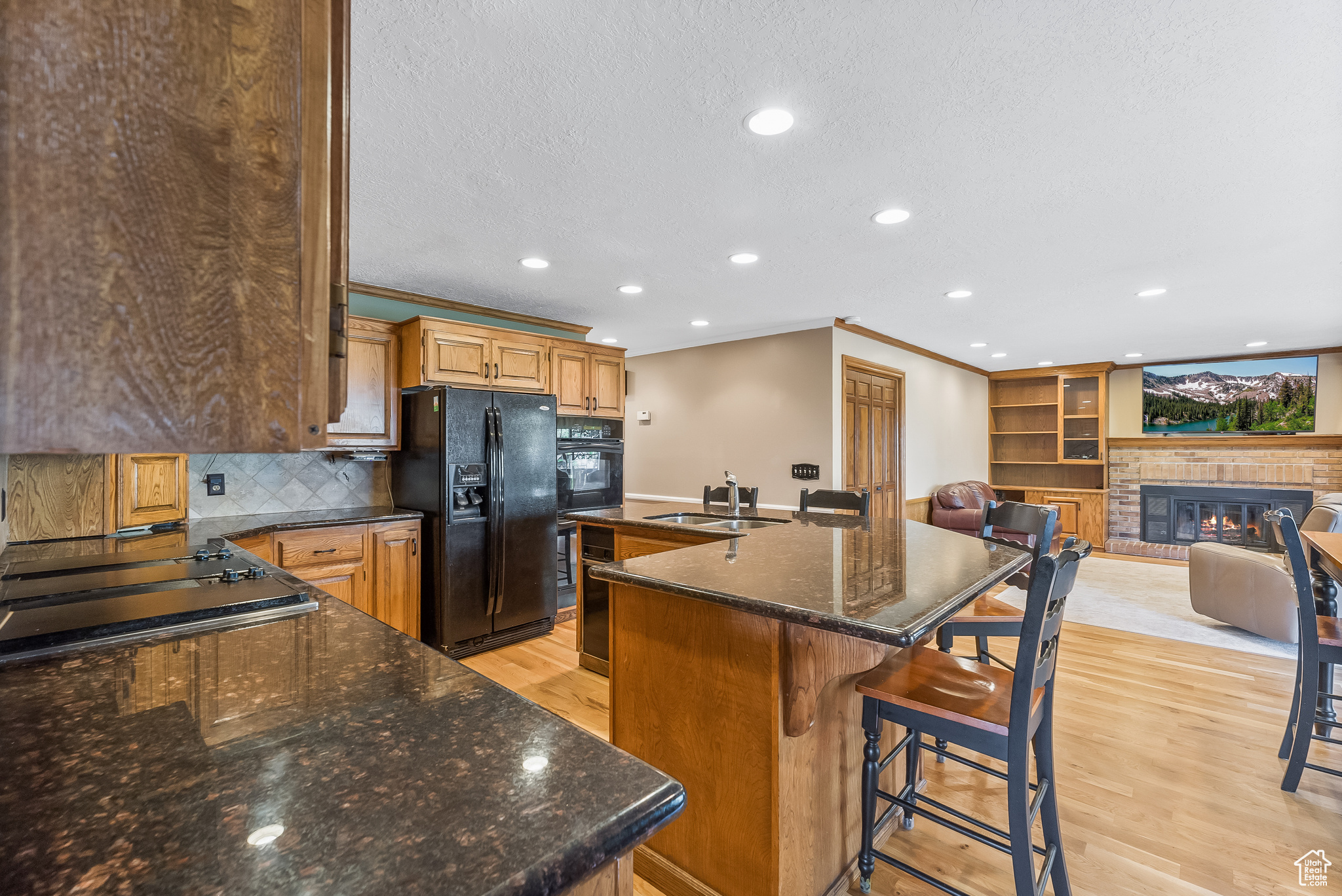 Kitchen with granite countertops and hardwood flooring