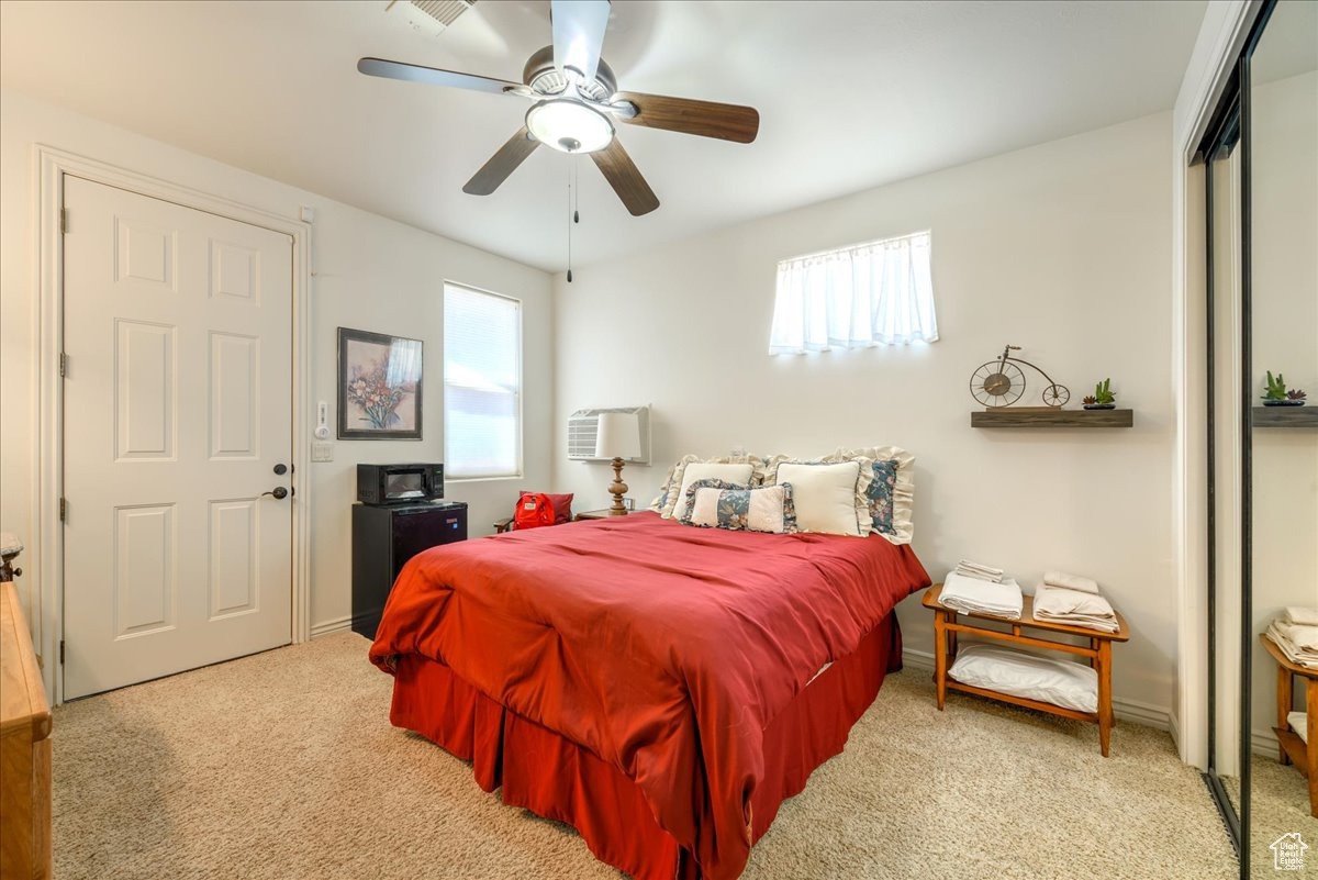 Casita Bedroom carpeted with ceiling fan