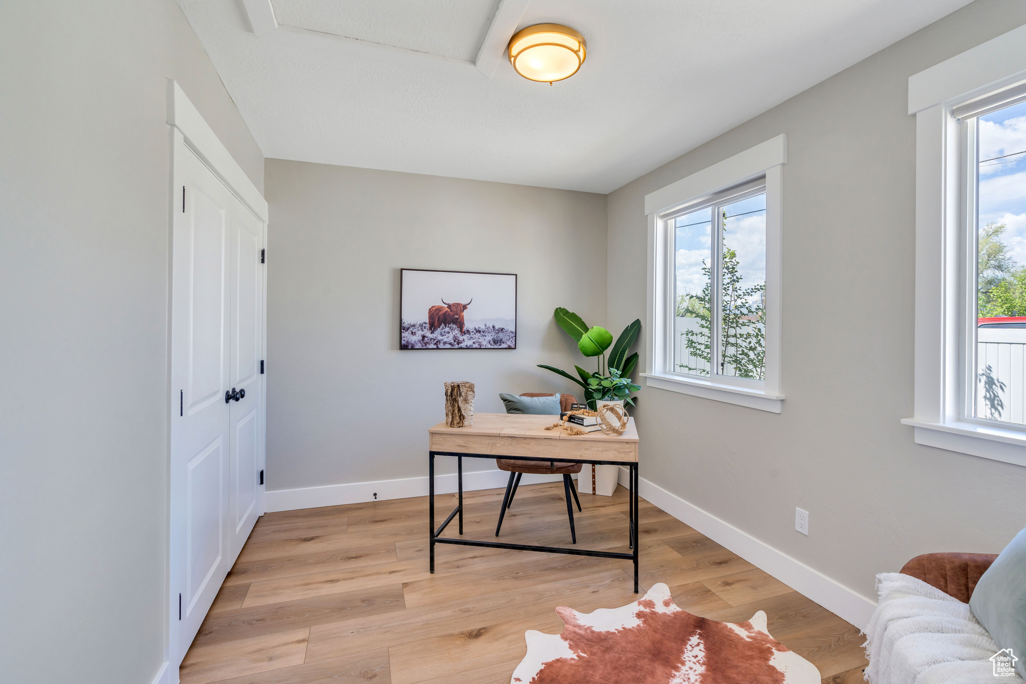 Bedroom or Home office featuring light hardwood / wood-style floors