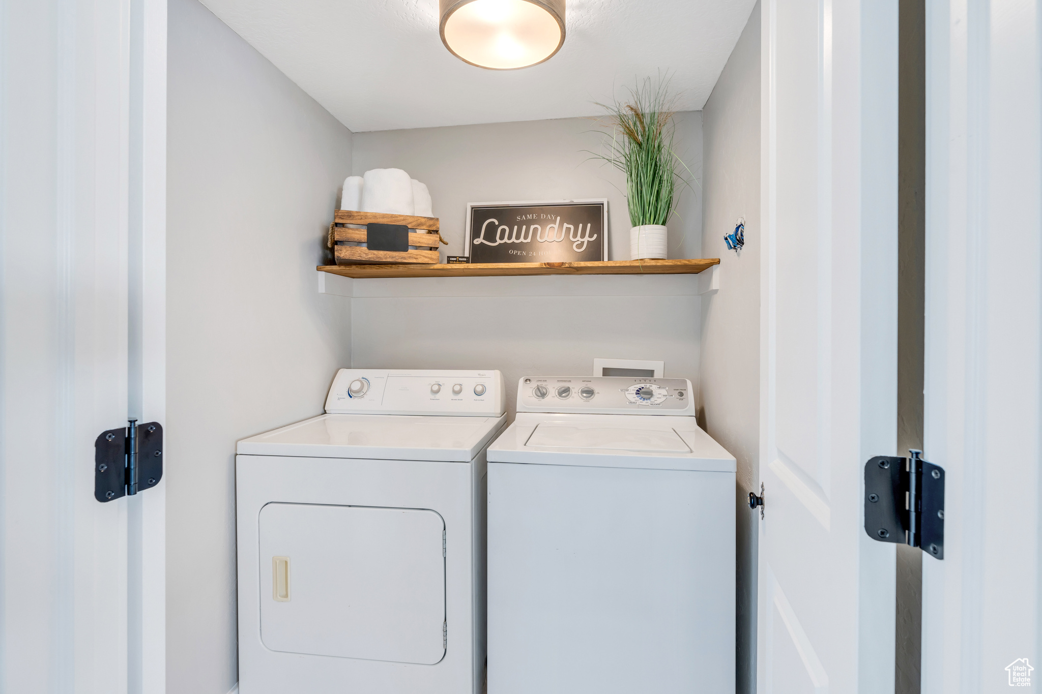 Laundry area with hookup for a washing machine and washer and clothes dryer