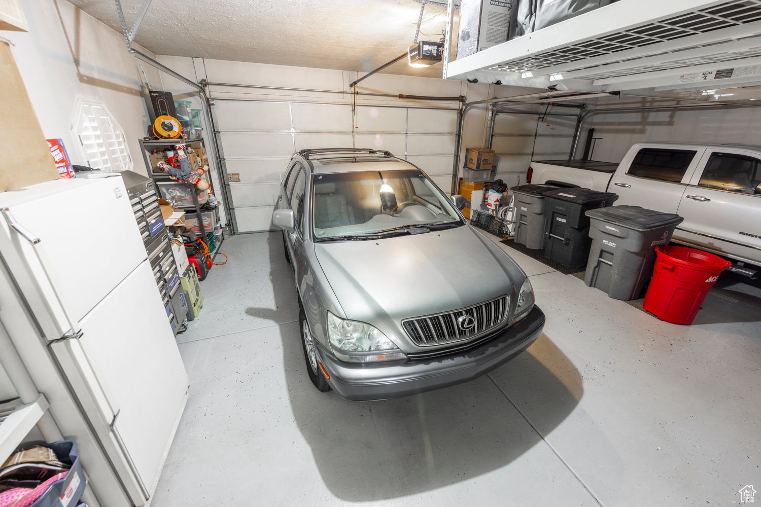 View of garage area (this refrigerator is excluded)