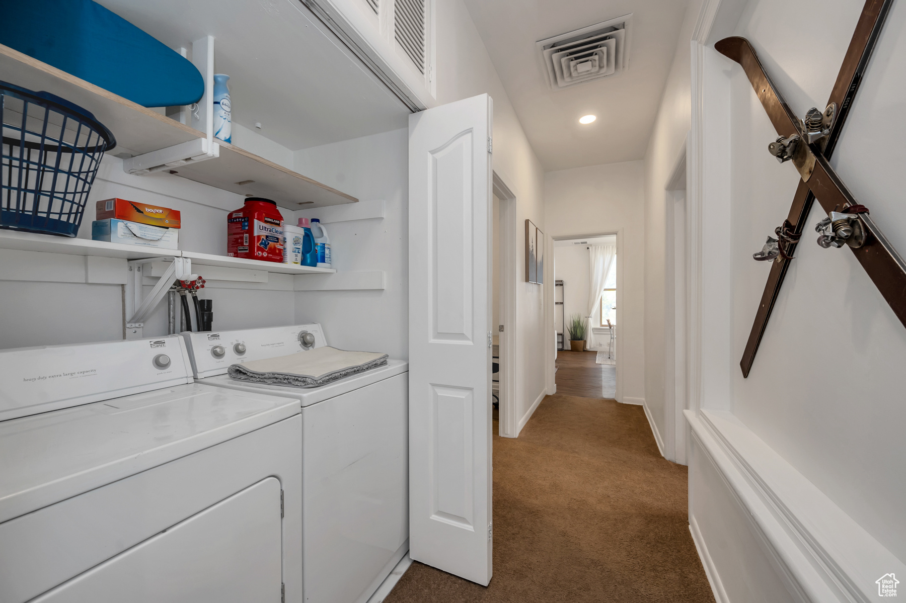 Laundry area with carpet flooring and washer and clothes dryer