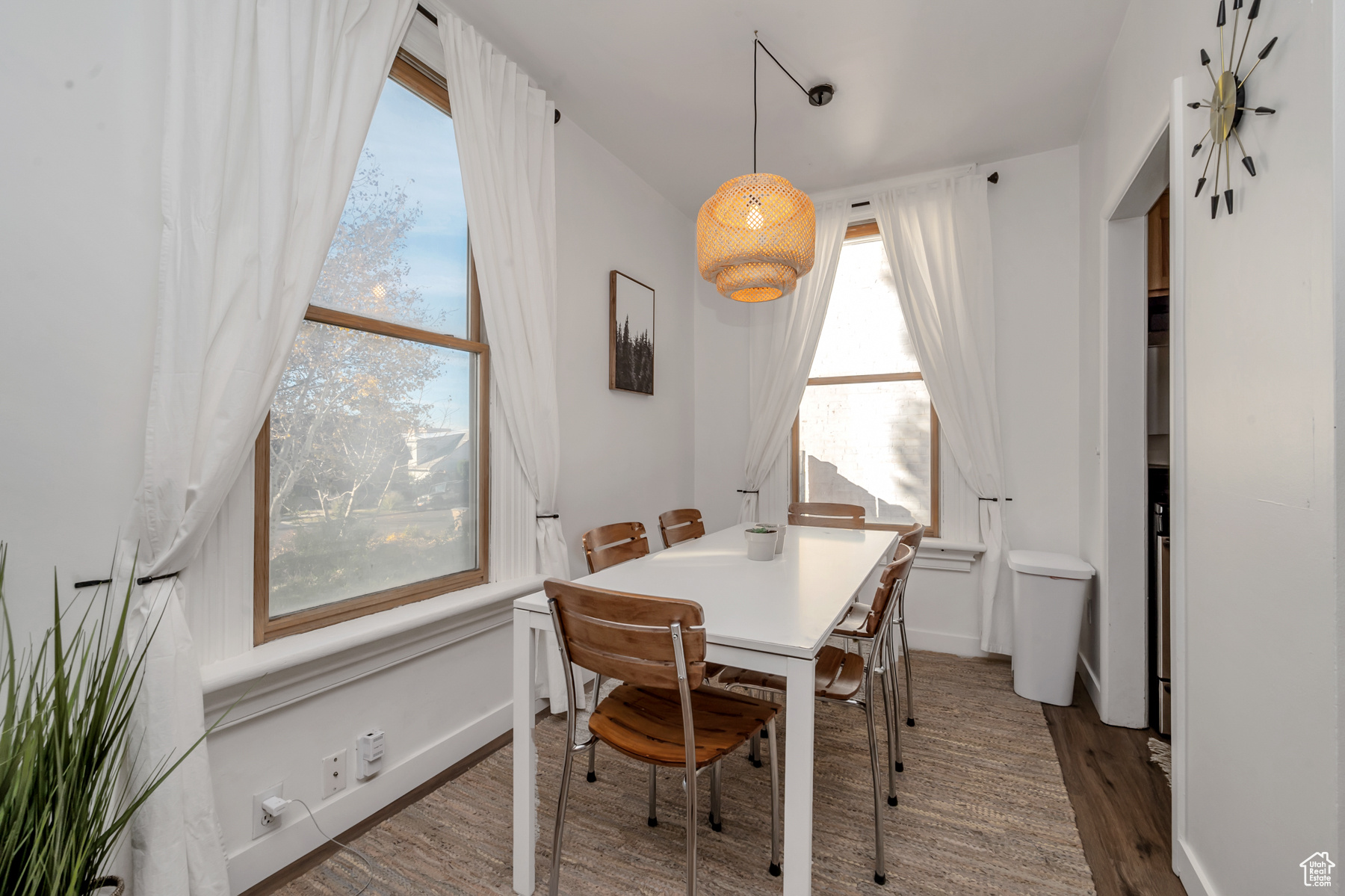 Dining space with wood-type flooring