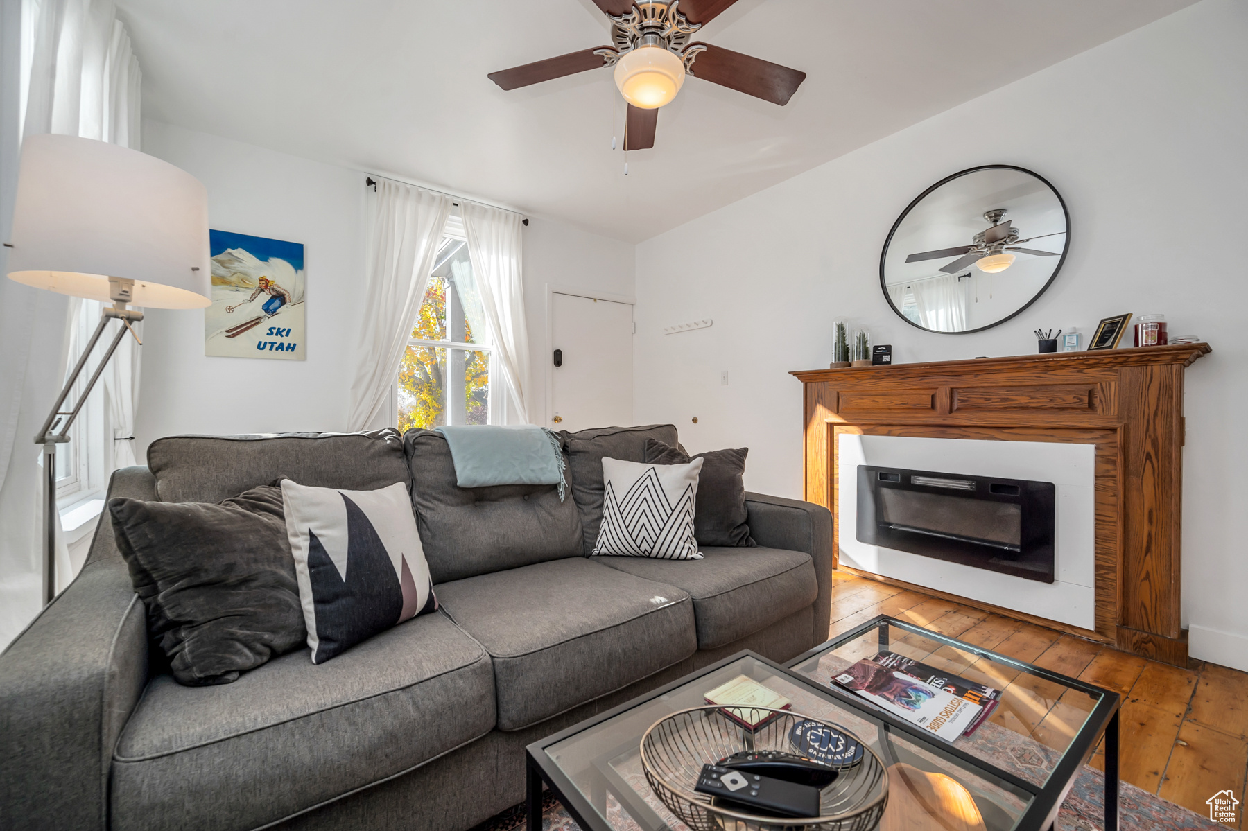 Living room featuring hardwood / wood-style floors and ceiling fan