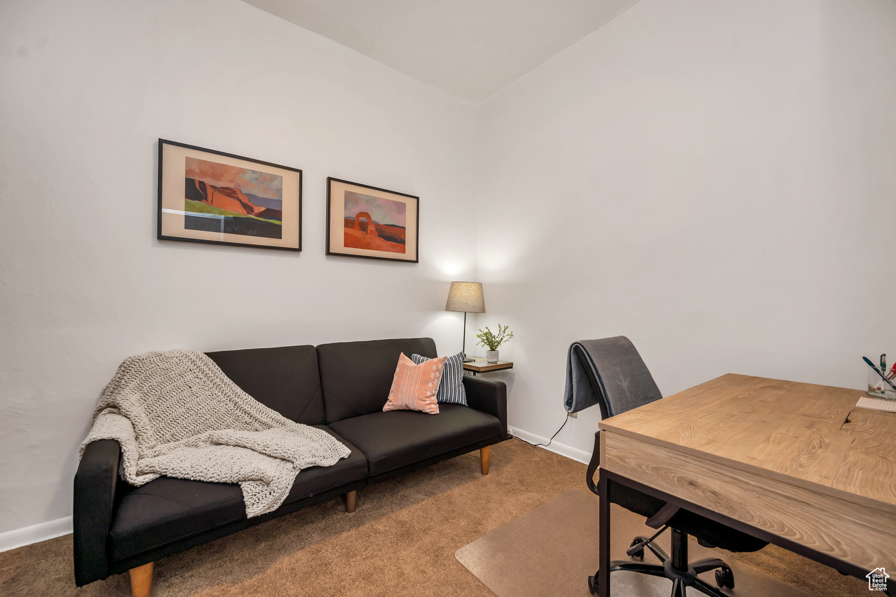 Home office/den featuring lofted ceiling and carpet floors