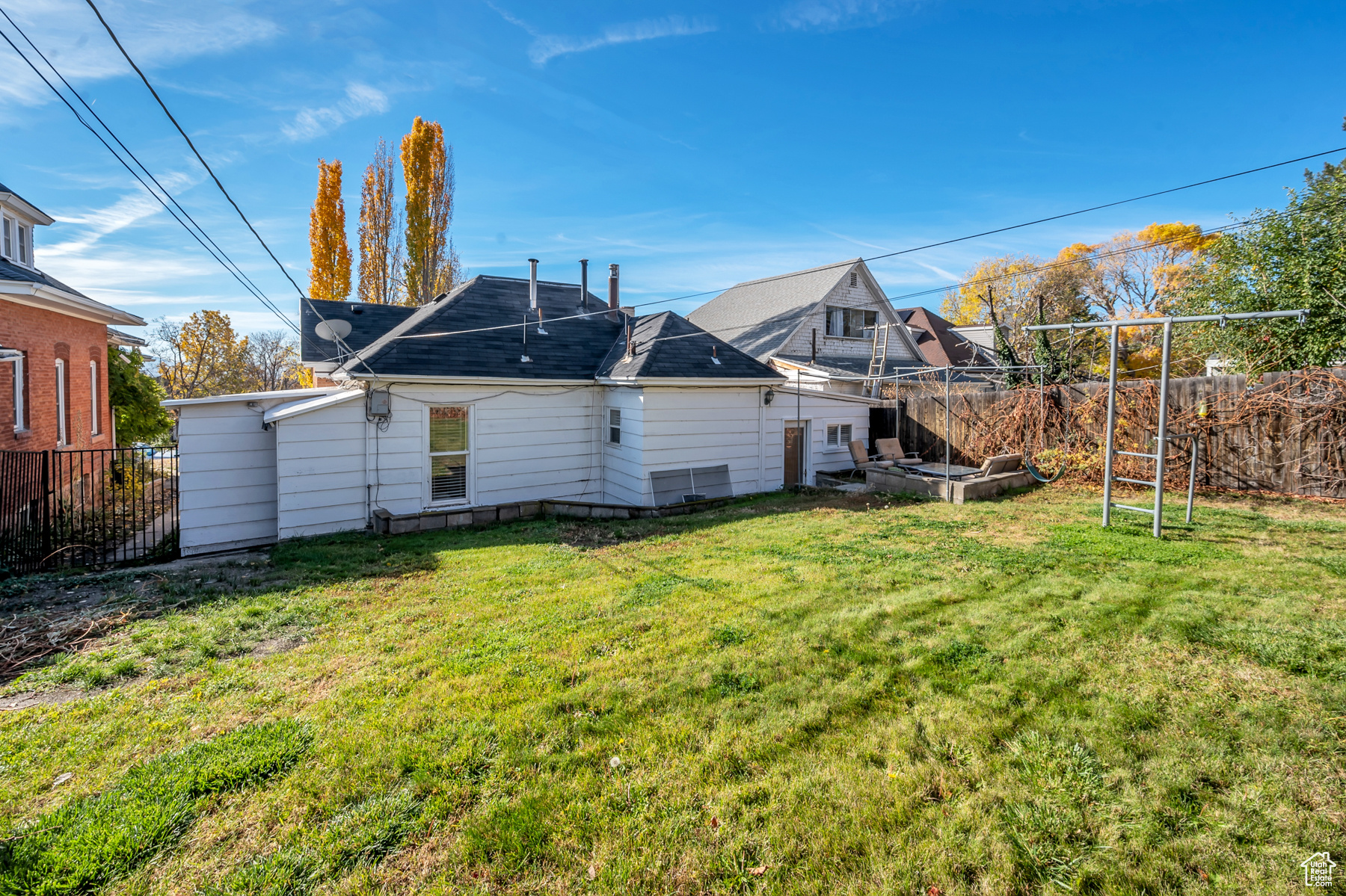 Backyard view of property with a lawn