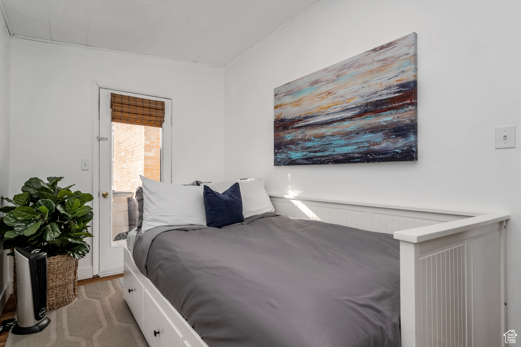 Bedroom featuring light carpet