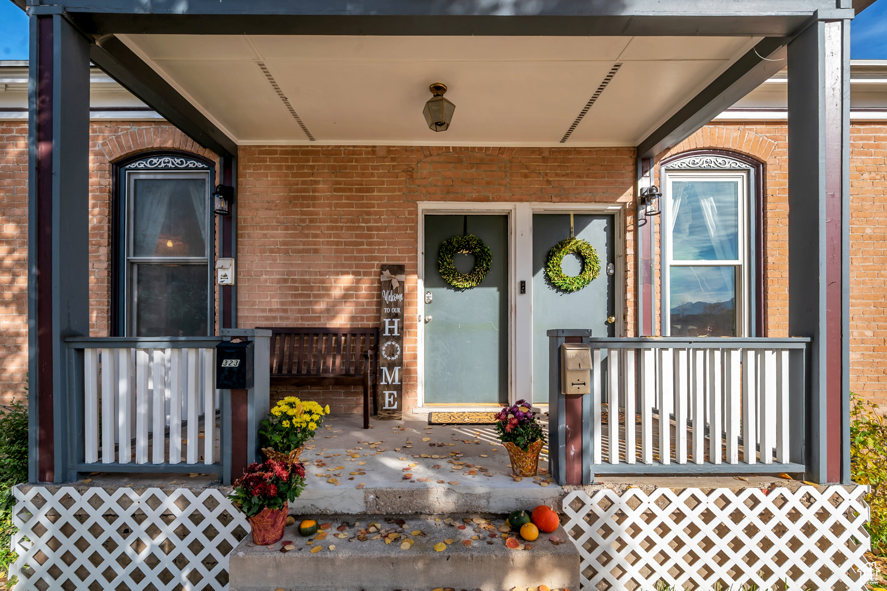 View of exterior entry with a porch