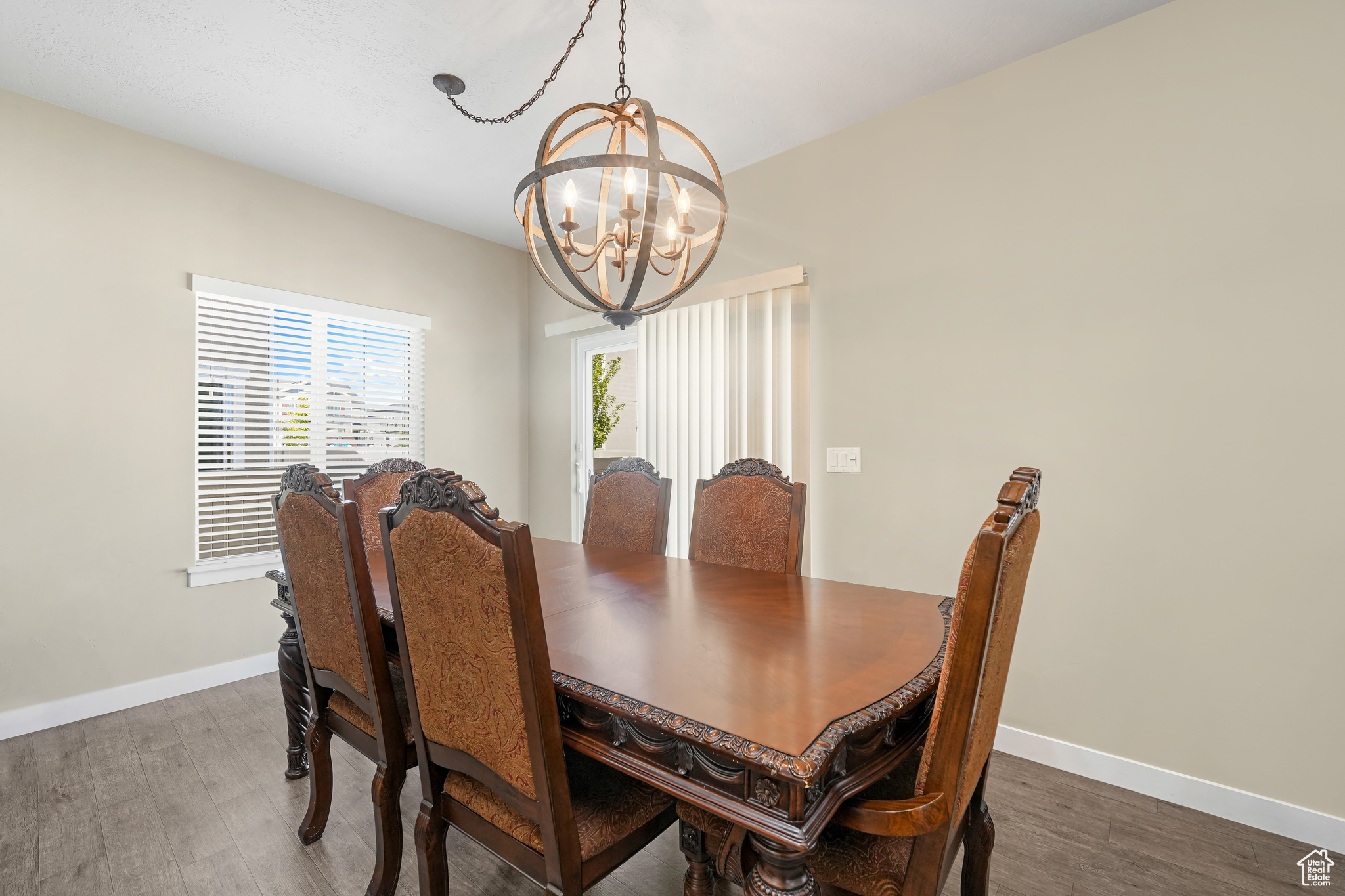 Dining room featuring a chandelier and dark hardwood / wood-style floors