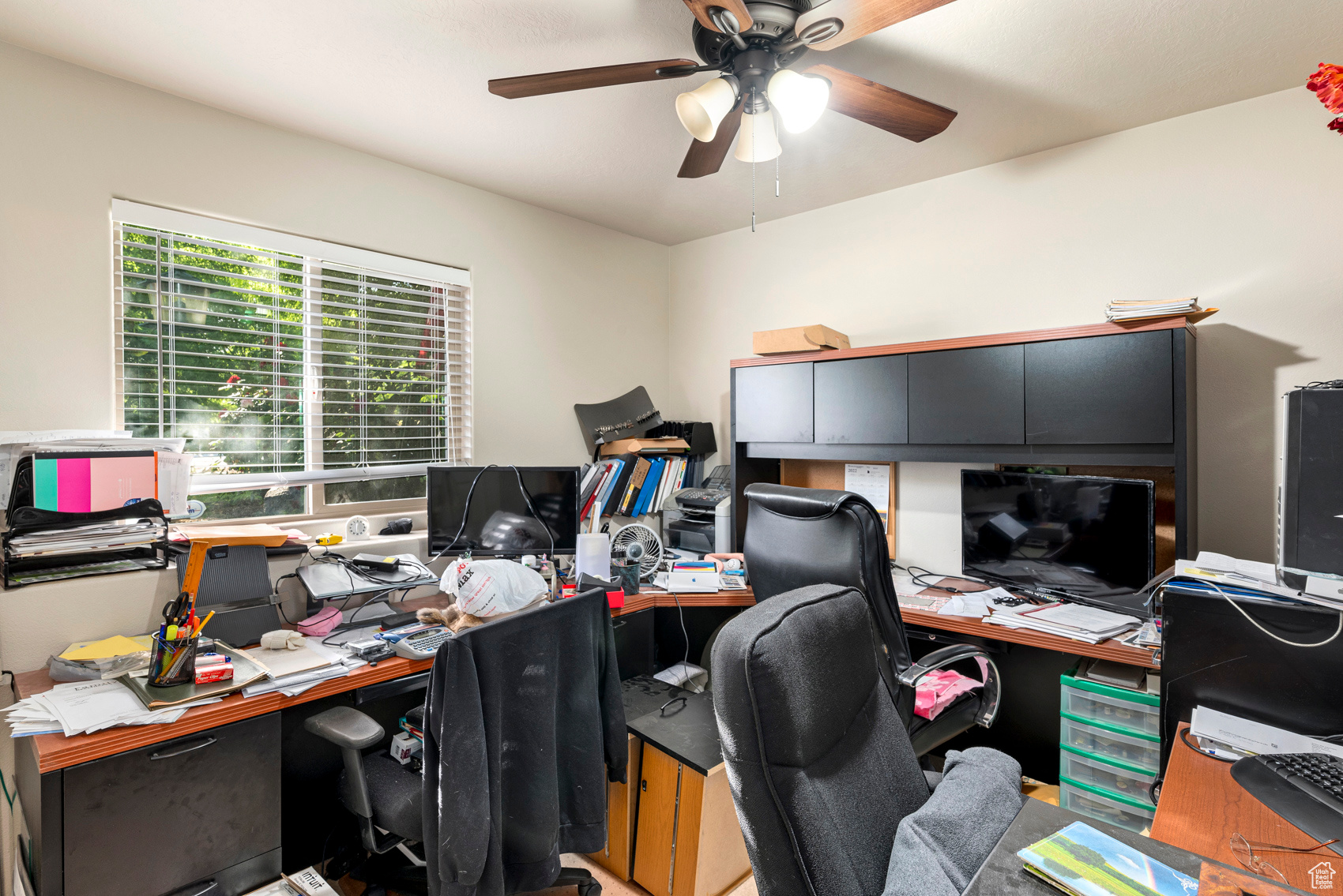 Home office featuring ceiling fan