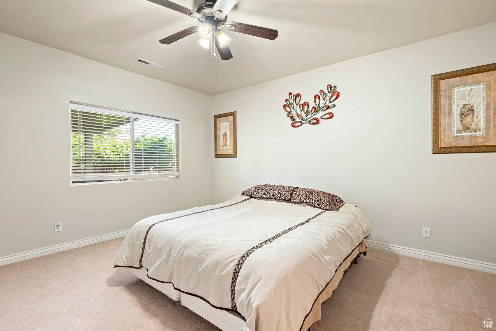 Bedroom with ceiling fan and carpet