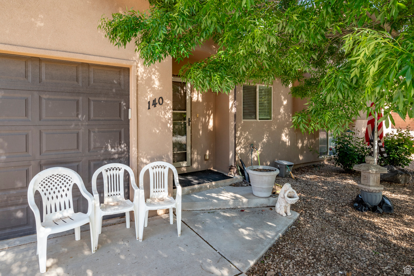 Doorway to property featuring a garage