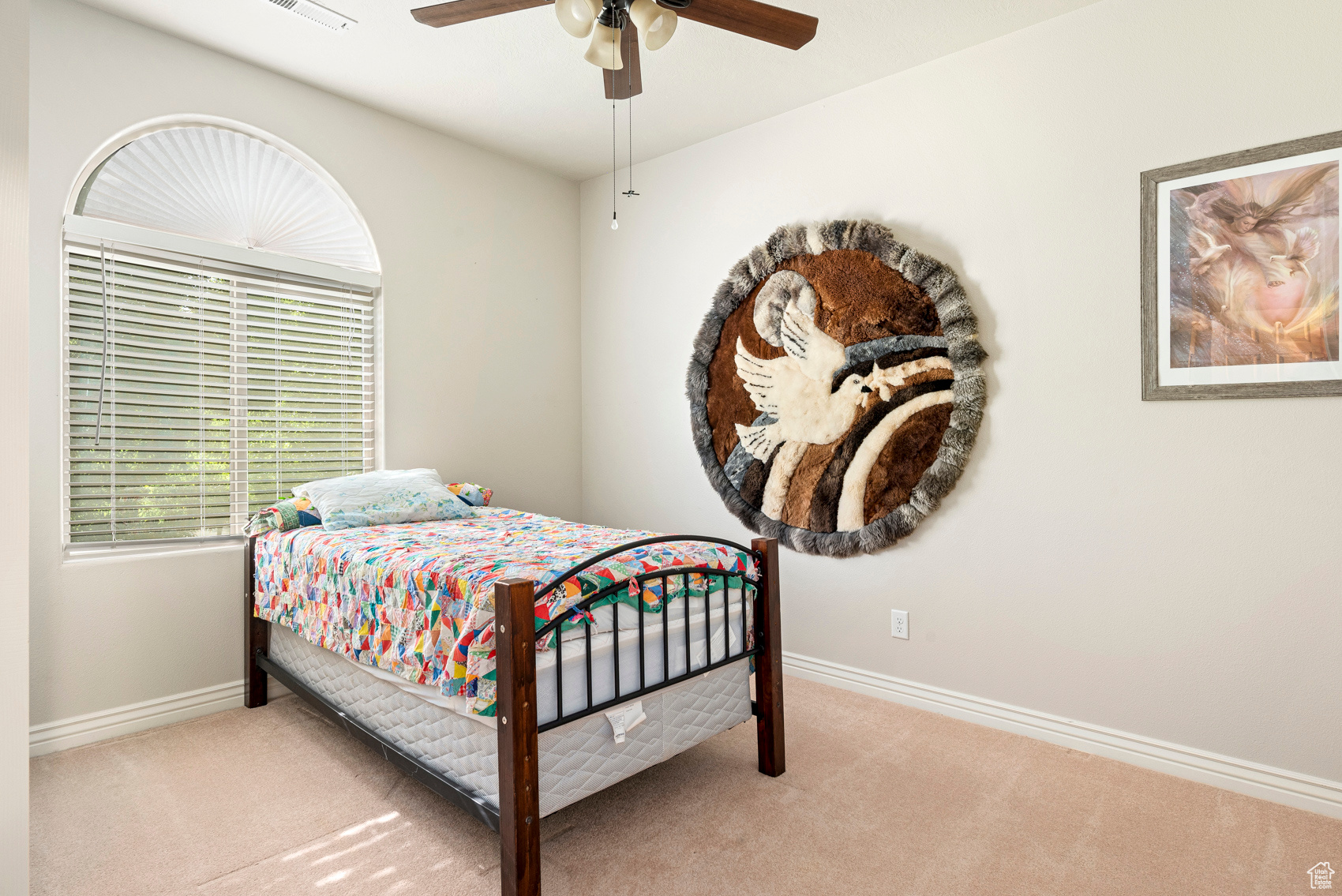 Bedroom featuring carpet and ceiling fan