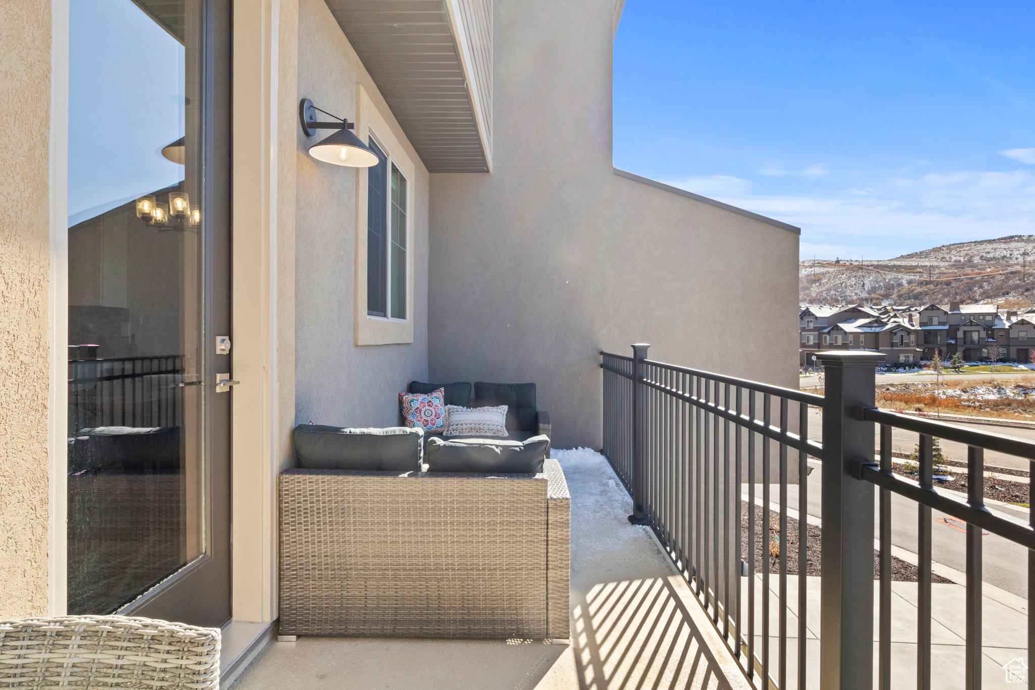 Balcony featuring an outdoor living space and a mountain view