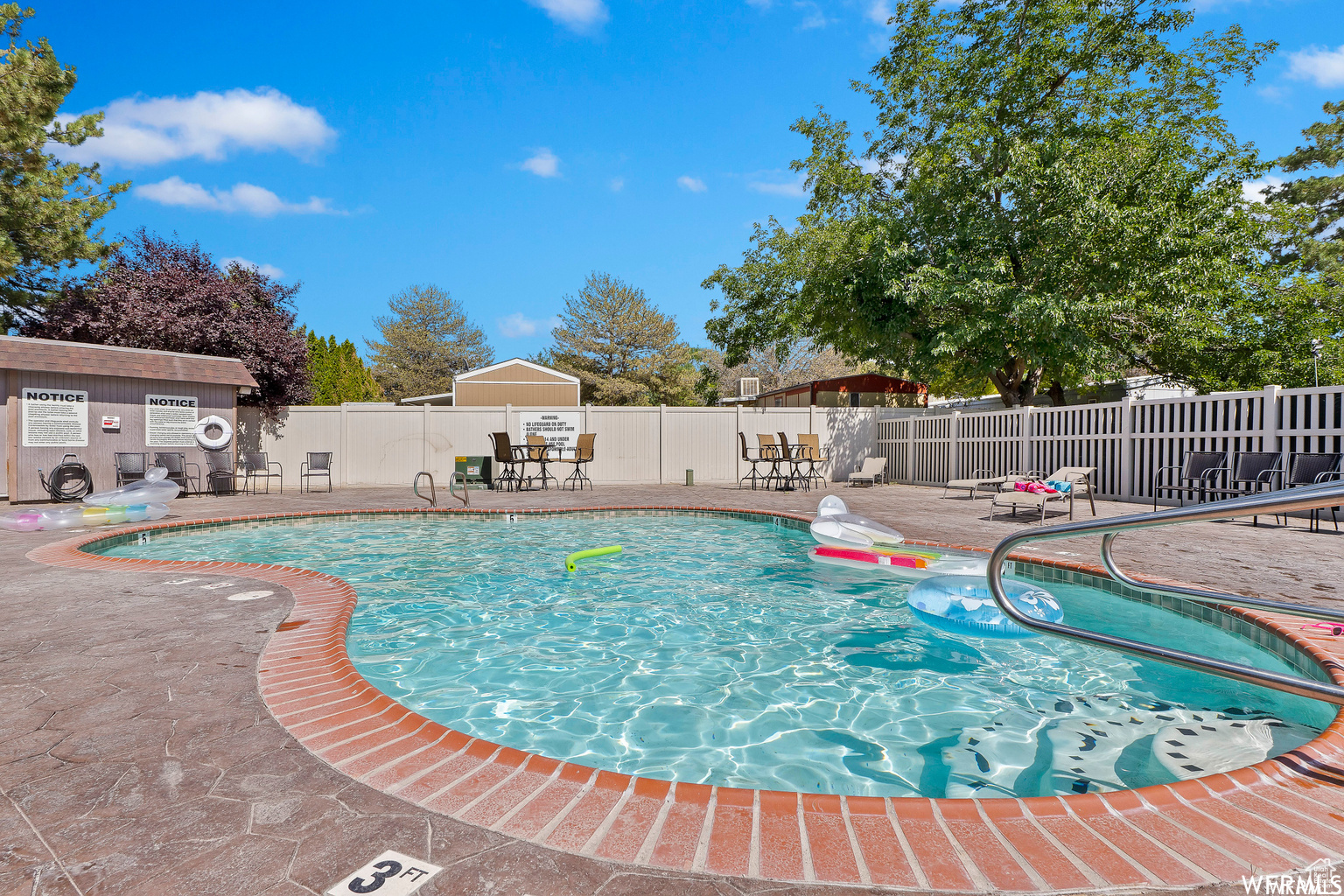 View of swimming pool with a patio