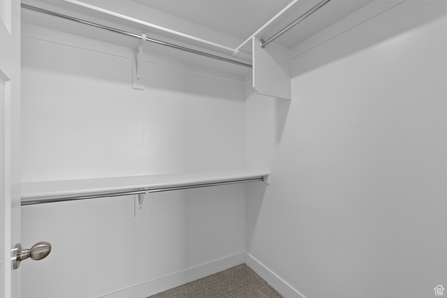 Spacious closet with carpet flooring