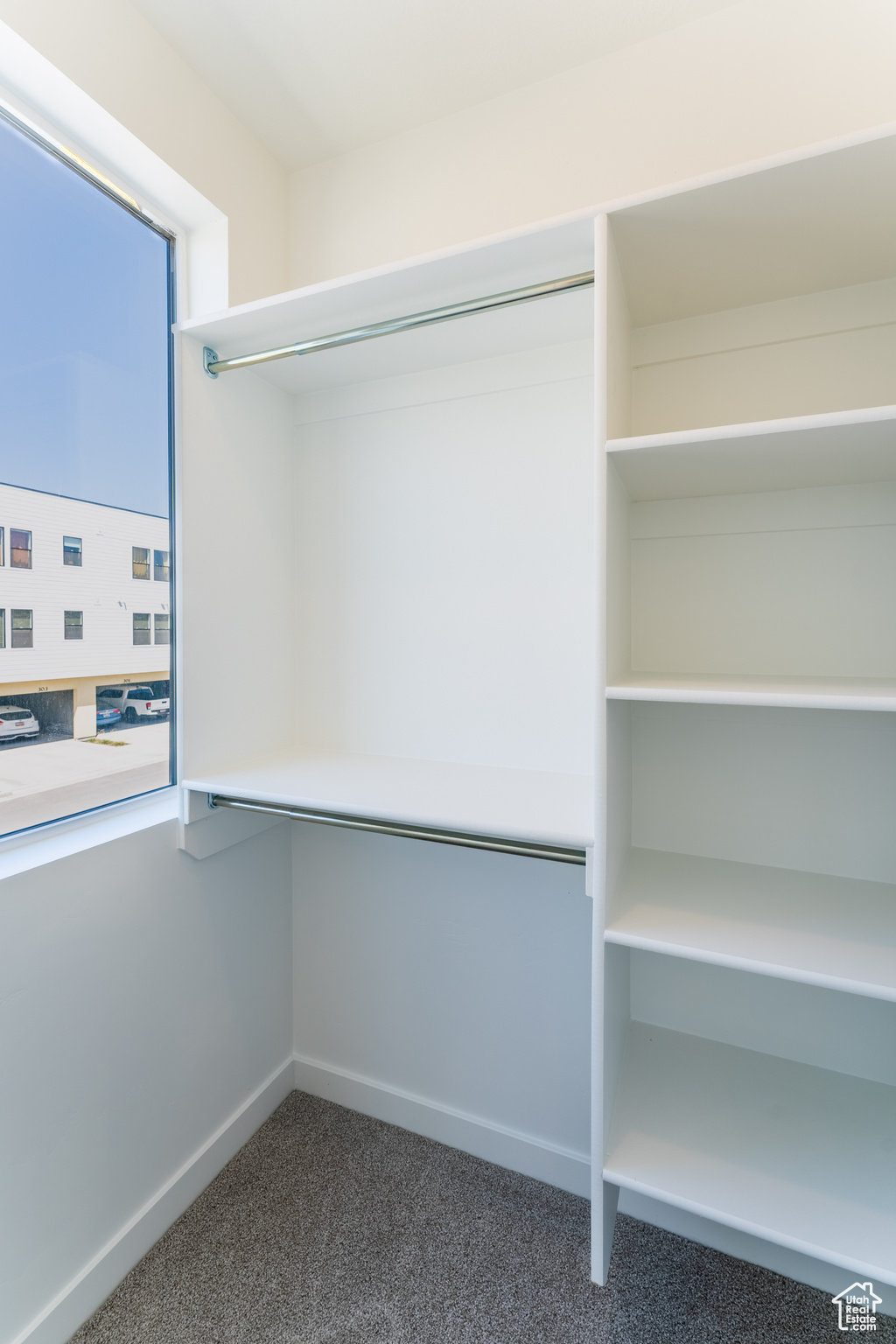 Spacious closet with carpet floors