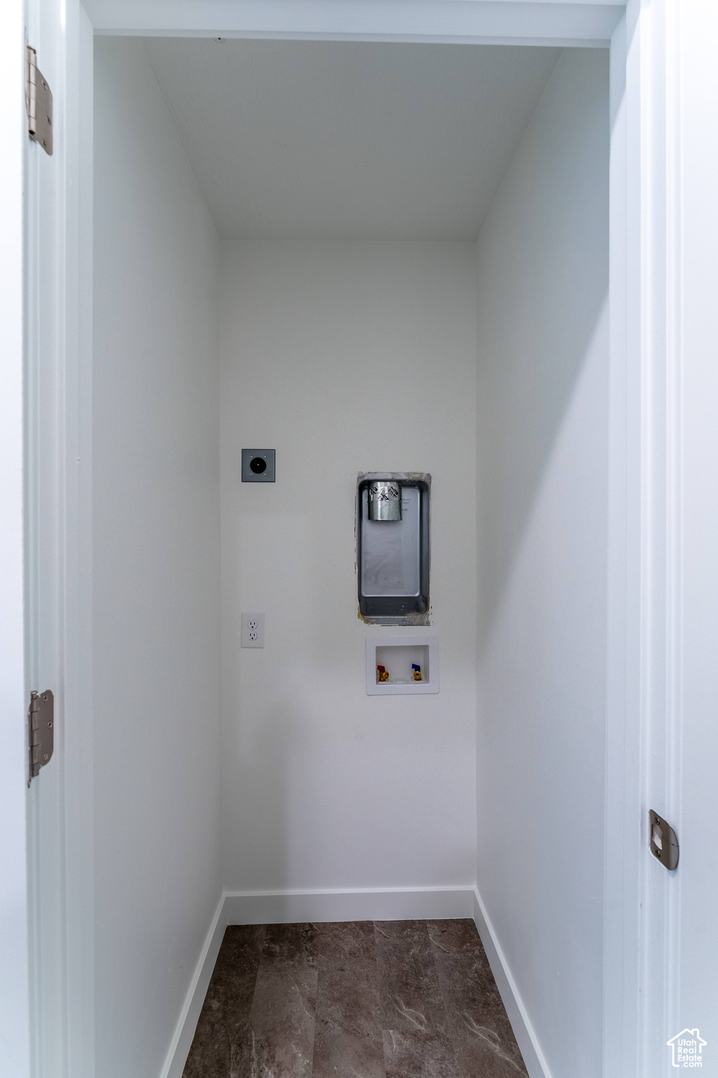 Laundry room with electric dryer hookup, tile floors, and hookup for a washing machine