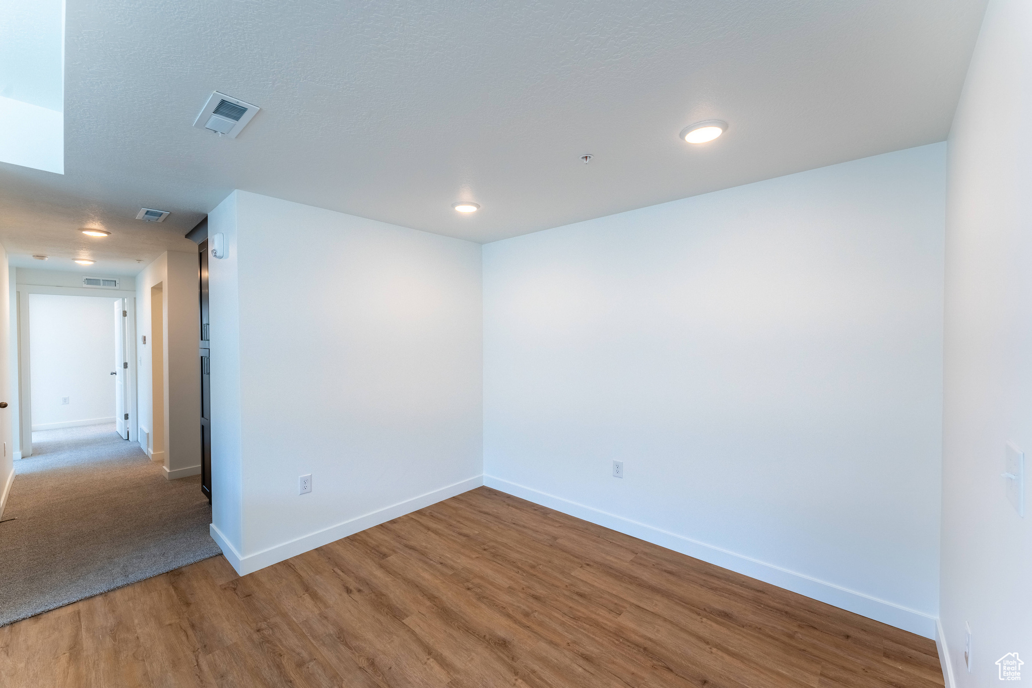 Empty room with wood-type flooring