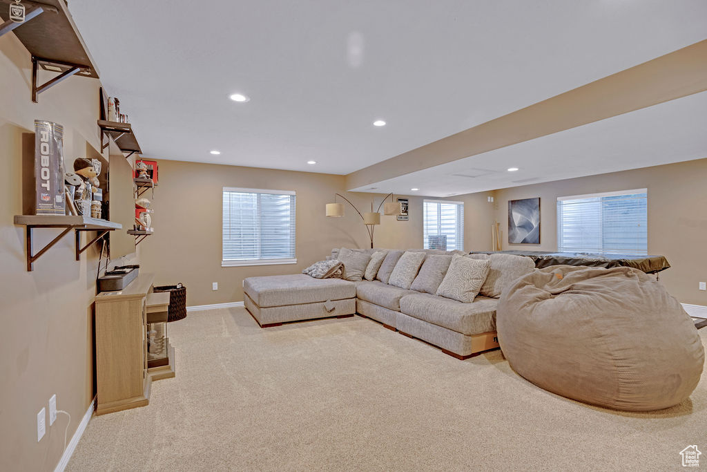 Basement Living room & theater with carpet flooring