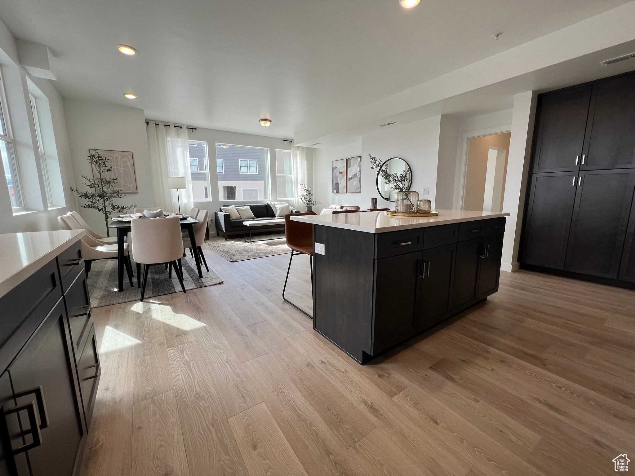 Kitchen featuring a center island, light hardwood / wood-style floors, and a wealth of natural light