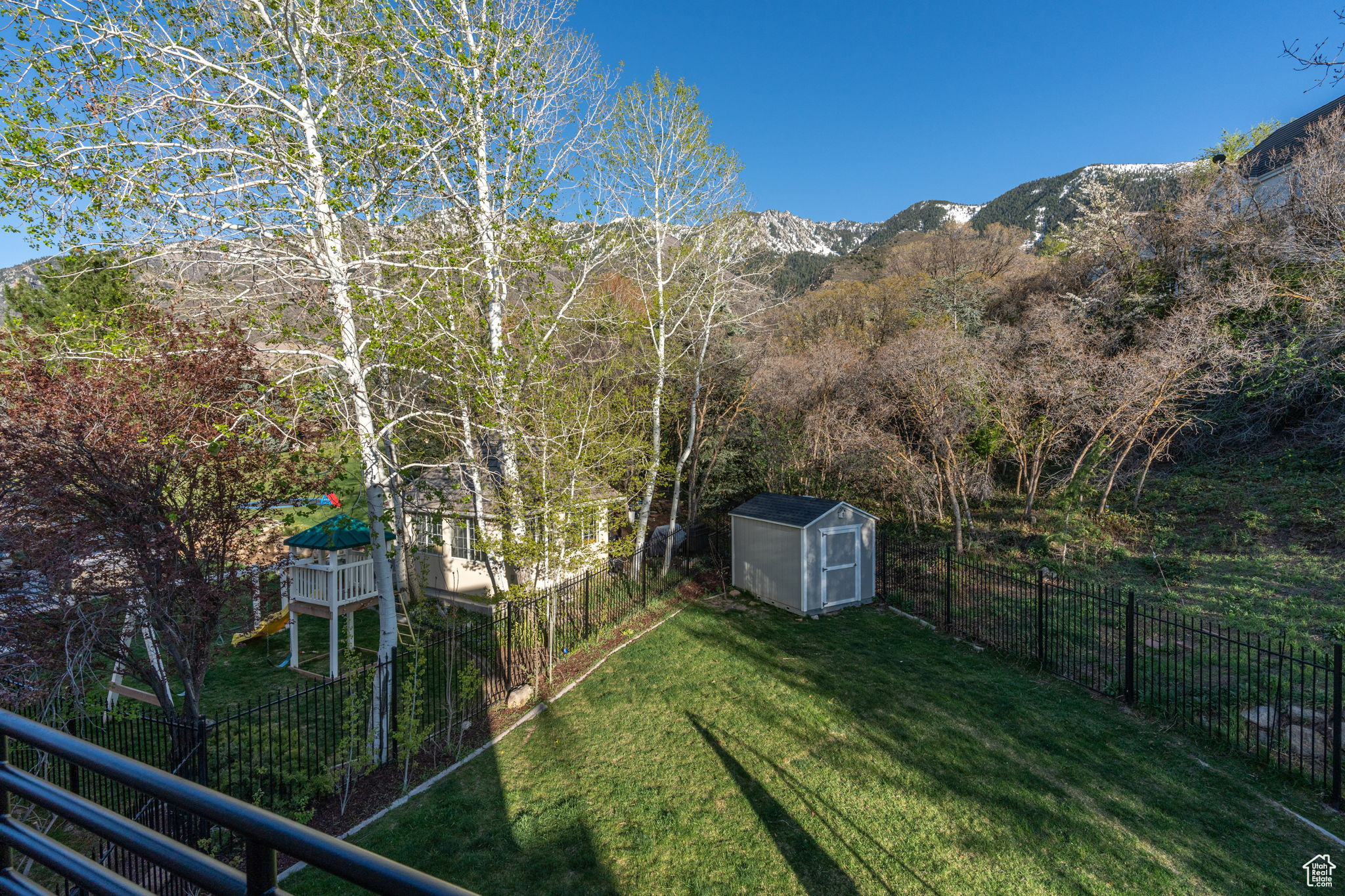 View of yard featuring a mountain view and a shed