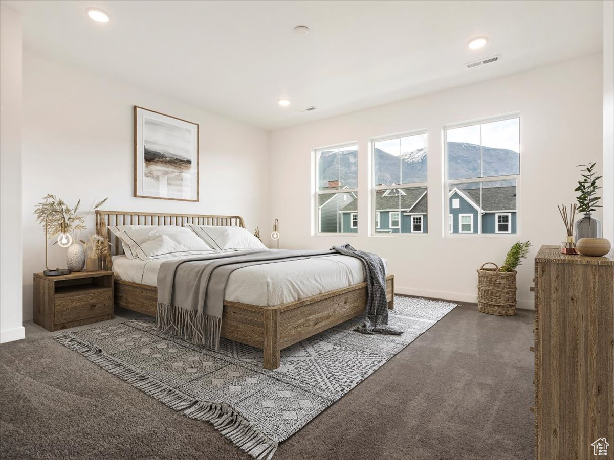 Bedroom featuring a mountain view and carpet floors