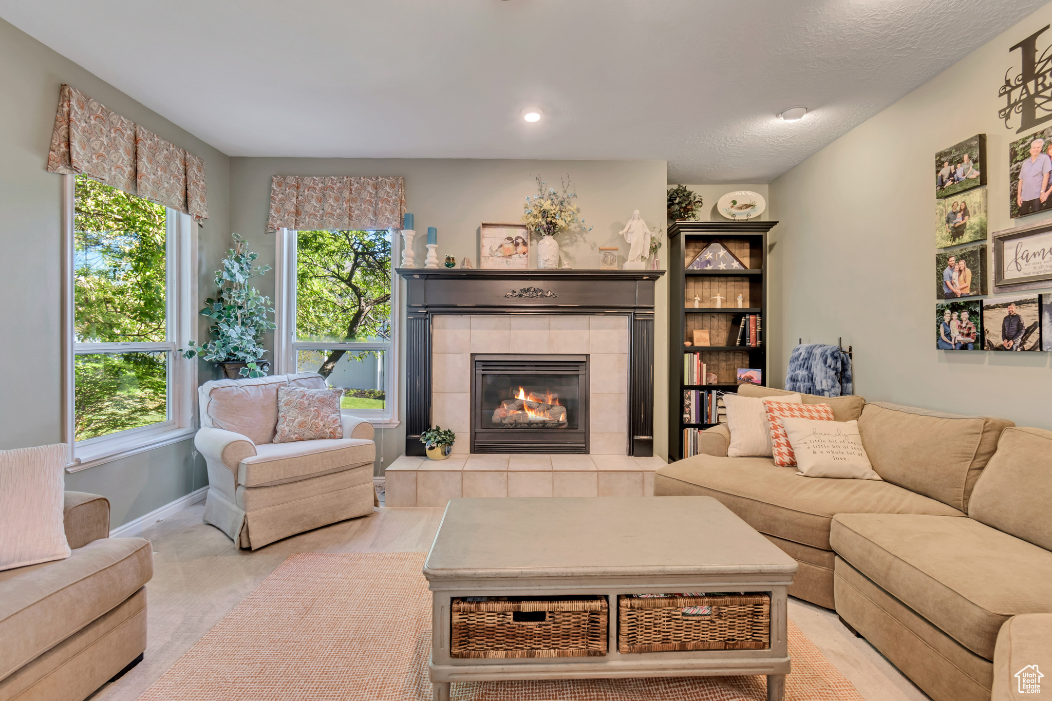 Family room featuring a tile fireplace