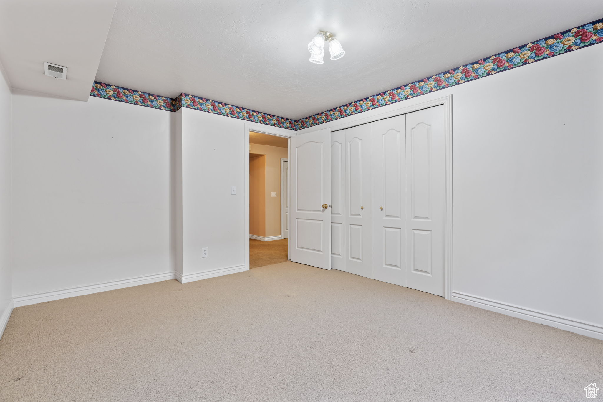 basement bedroom featuring a closet and carpet