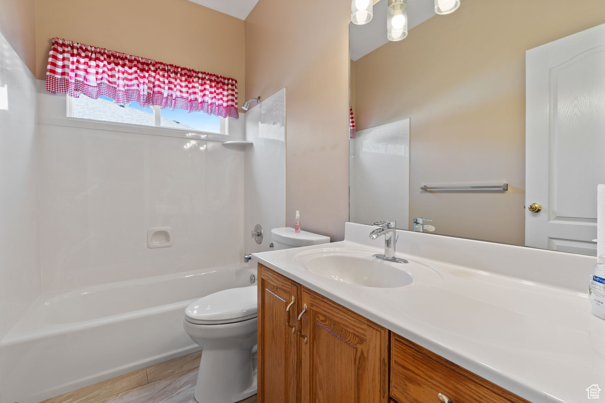 Hall Full bathroom with vanity,  shower combination, toilet, and tile flooring