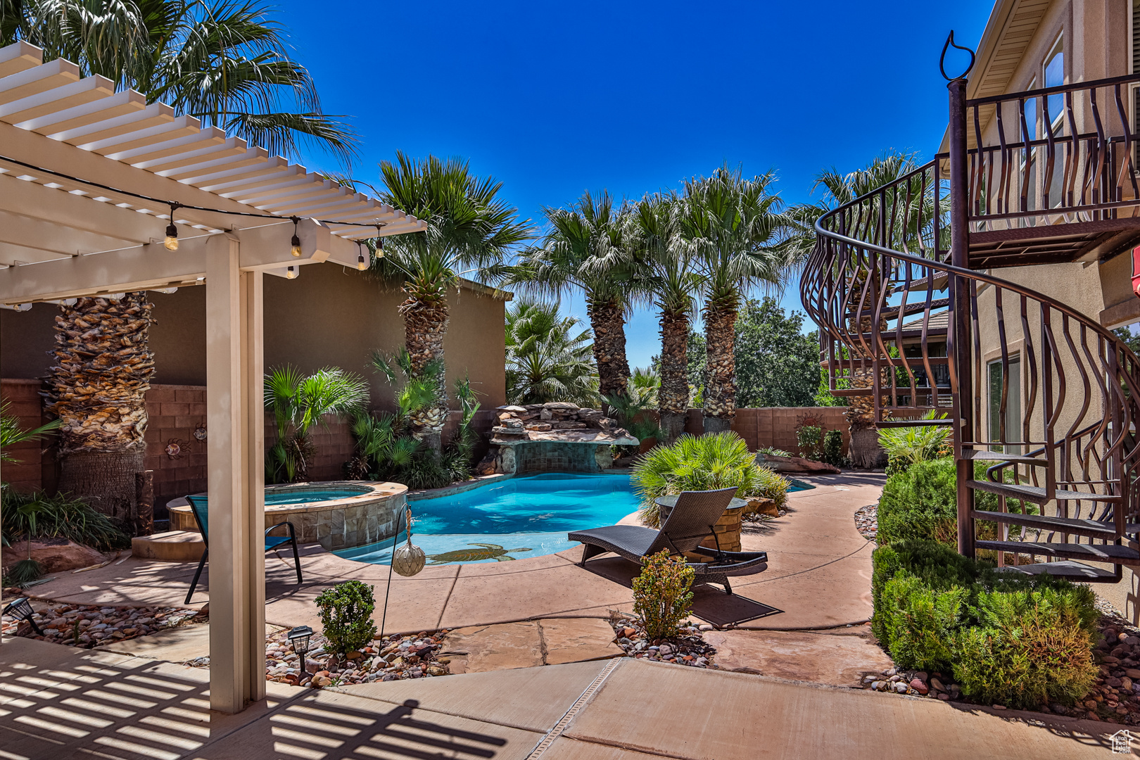View of swimming pool featuring a pergola, an in ground hot tub, and a patio area