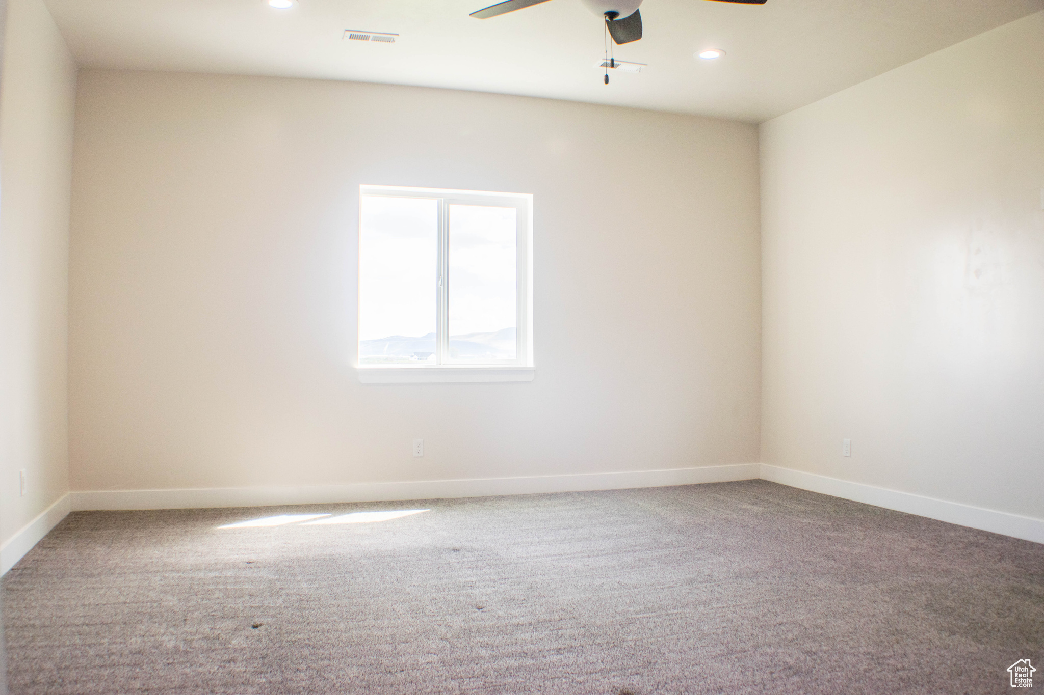 Master Bedroom carpeted room with ceiling fan