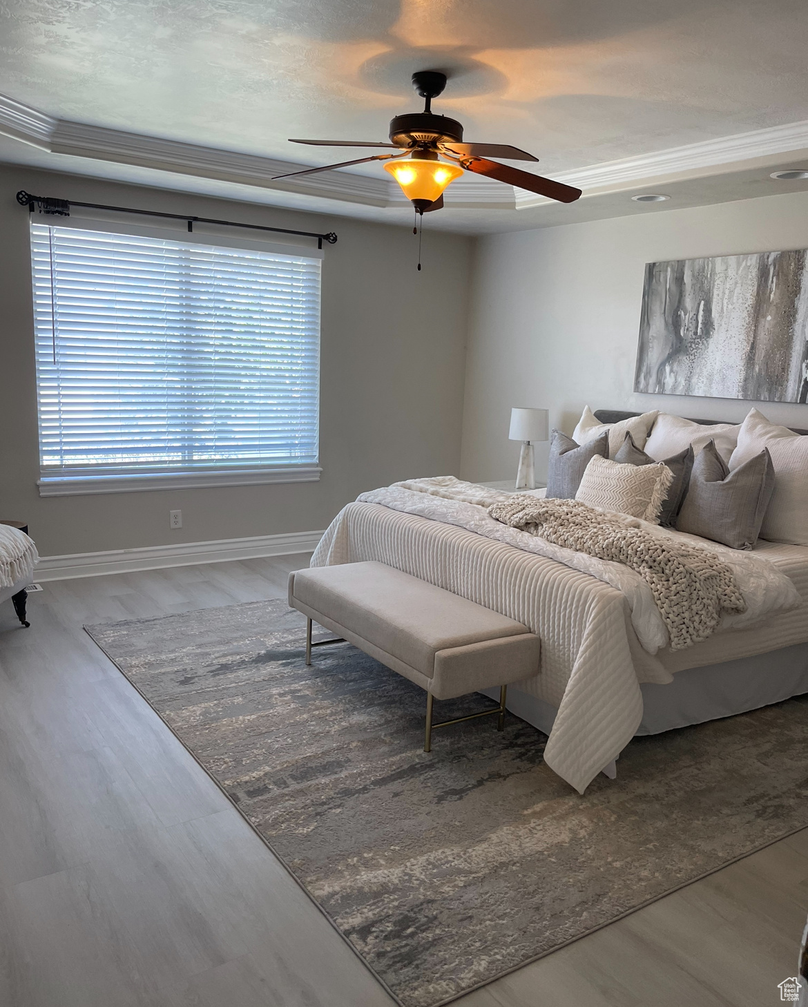 Bedroom featuring crown molding, multiple windows, ceiling fan, and hardwood / wood-style floors