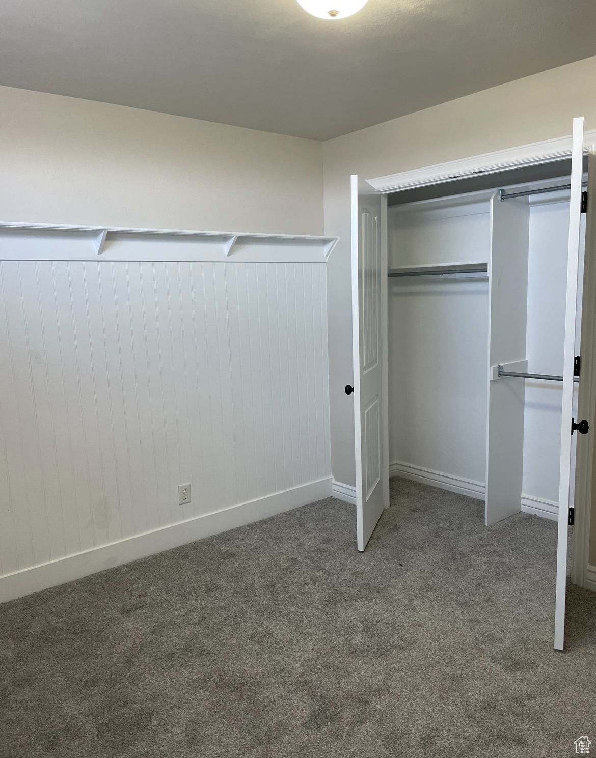 Walk in closet with carpet