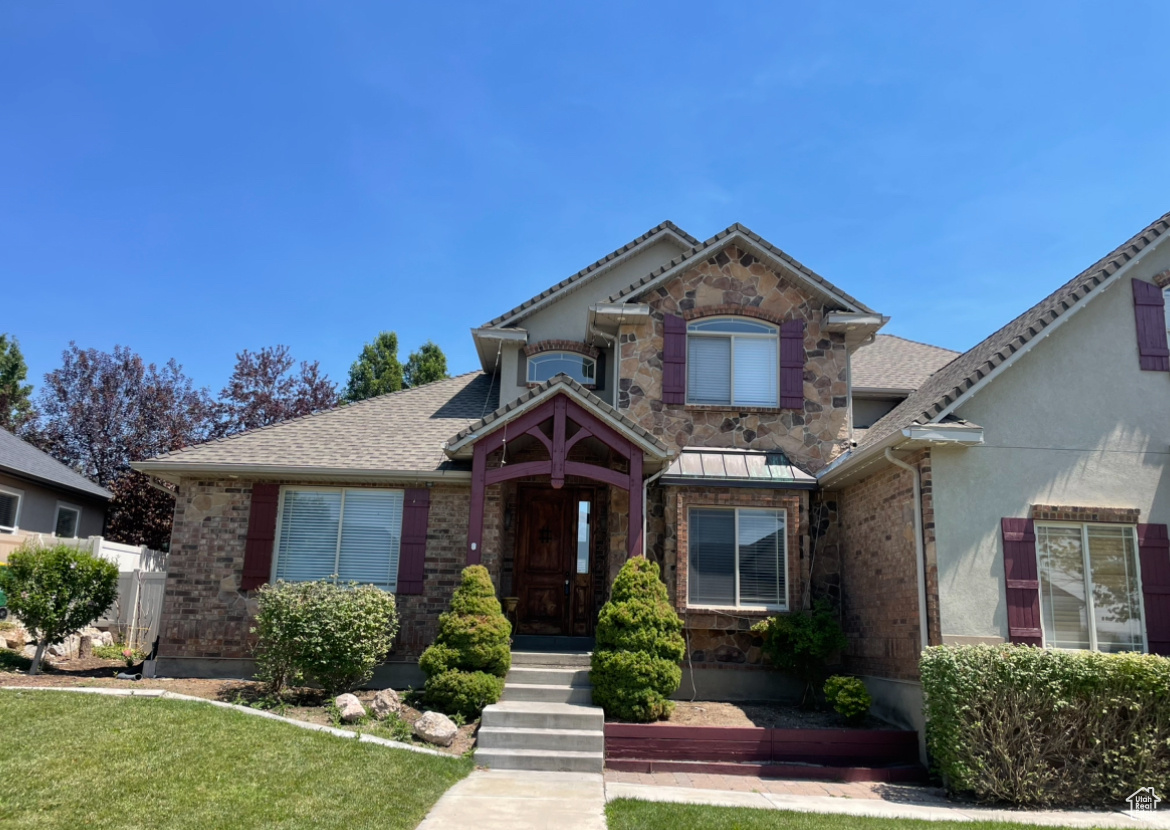 View of front of property with a front lawn