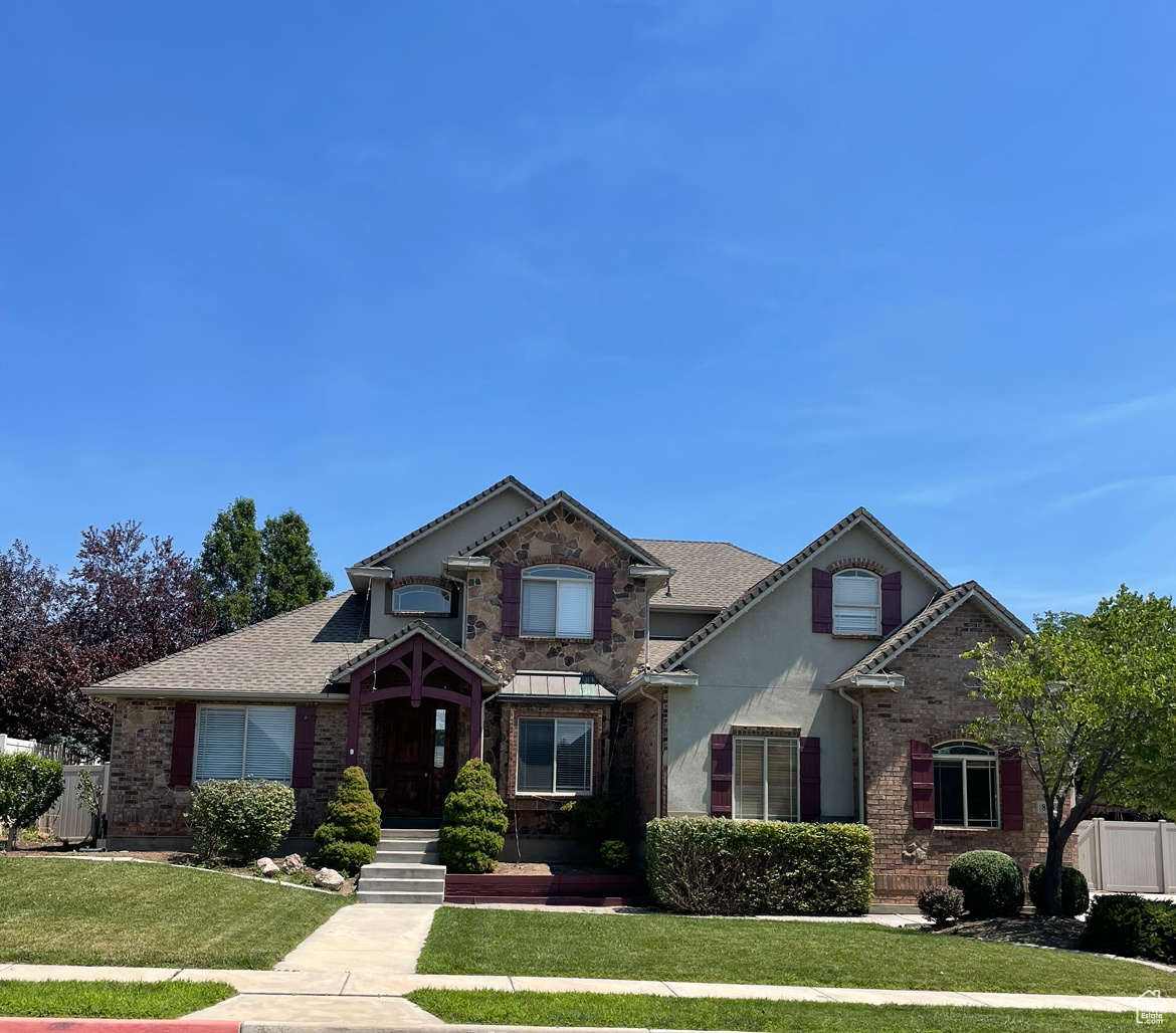 View of front of property with a front lawn