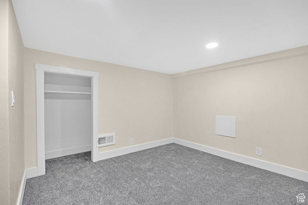 Unfurnished bedroom featuring a closet and carpet floors
