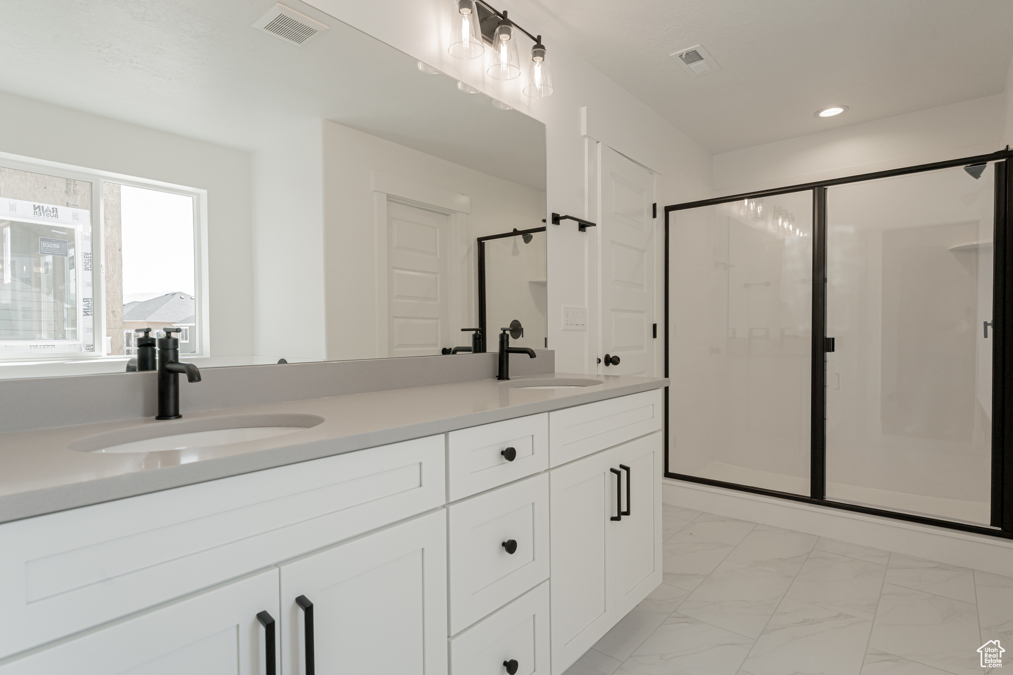 Bathroom featuring vanity and walk in shower