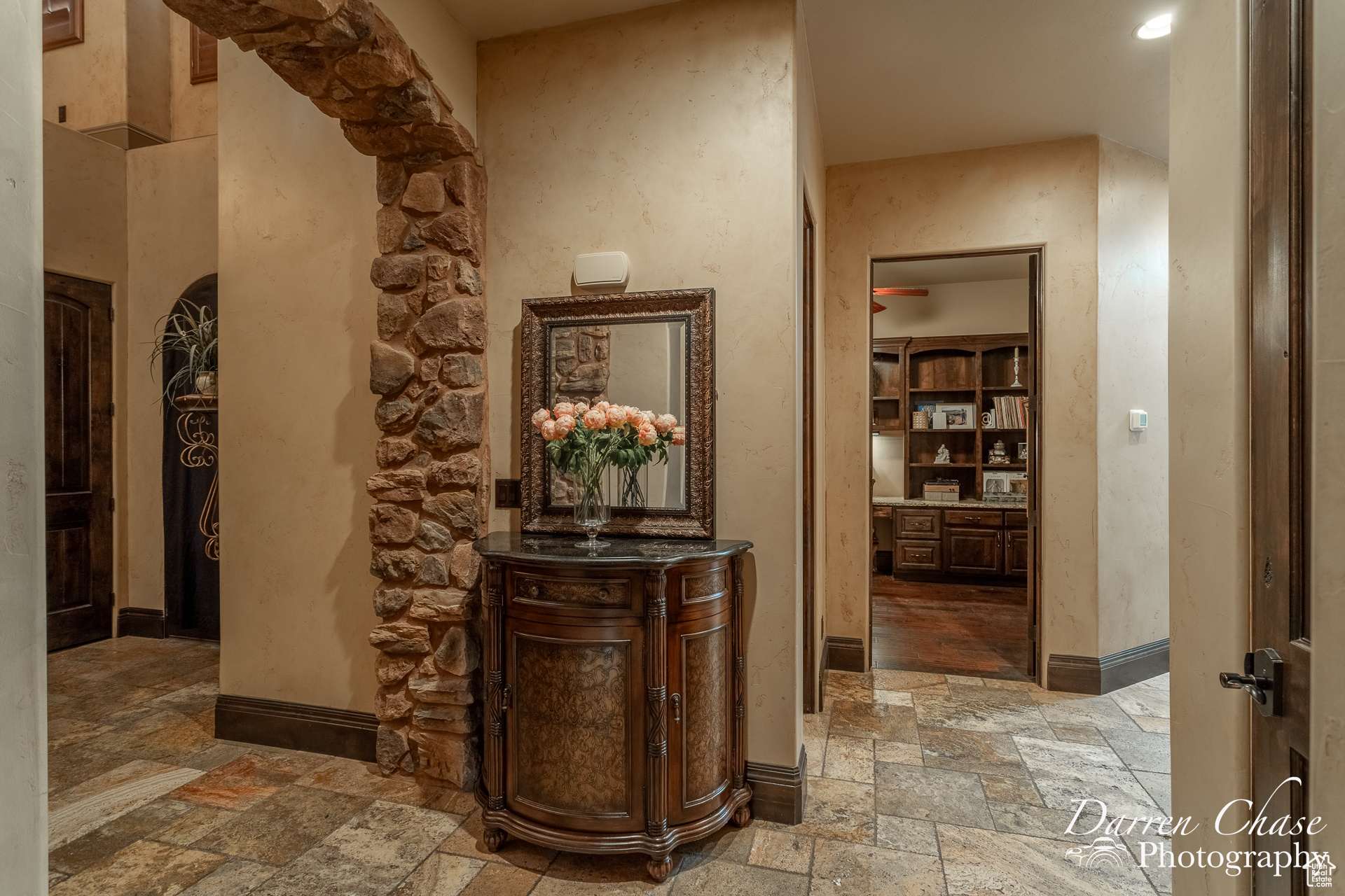 Entry hall with tile floors, doorway to office