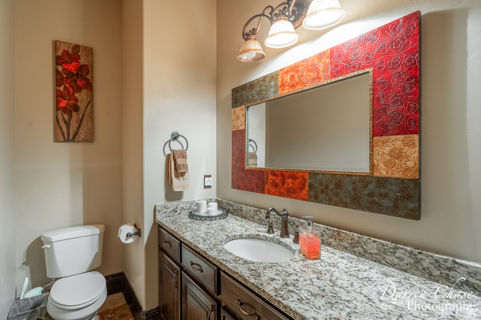 Half bathroom with vanity and toilet